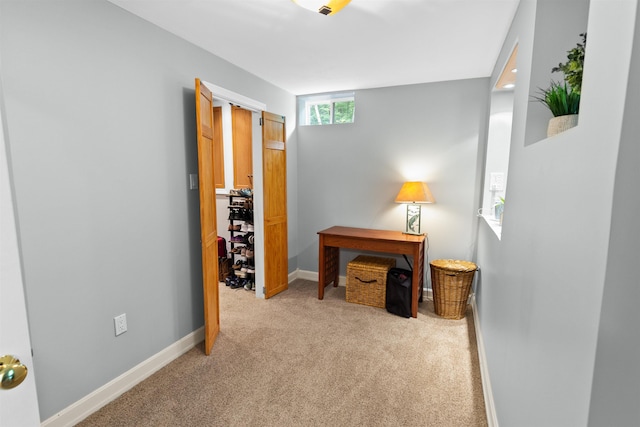 carpeted office with baseboards