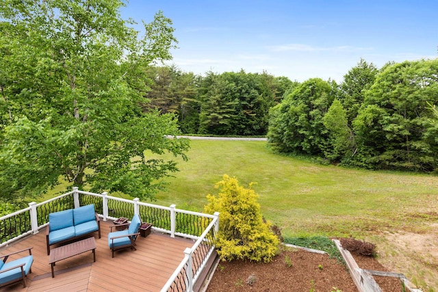 wooden deck with an outdoor hangout area and a yard