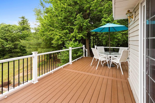 wooden deck featuring outdoor dining space