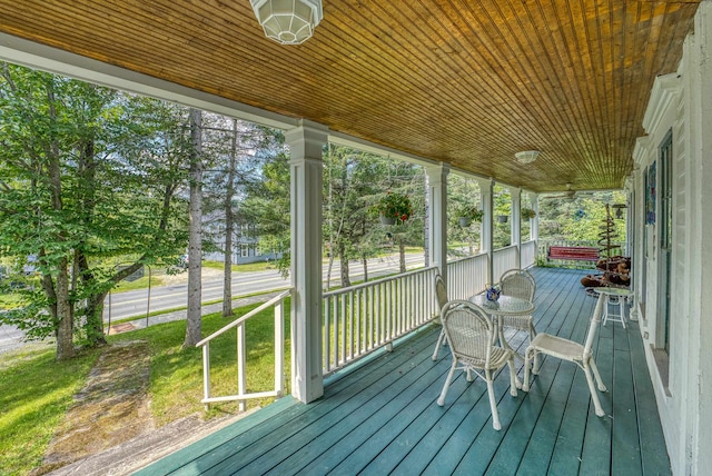 unfurnished sunroom featuring wooden ceiling