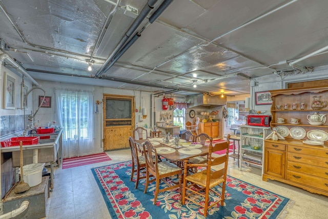 dining area featuring a healthy amount of sunlight and light floors