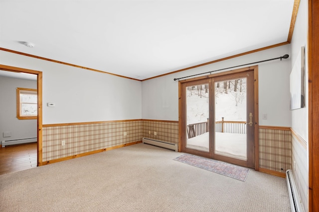 unfurnished room with wallpapered walls, baseboard heating, and a wainscoted wall