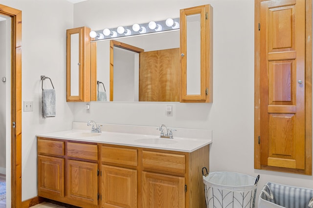 full bath with double vanity and a sink