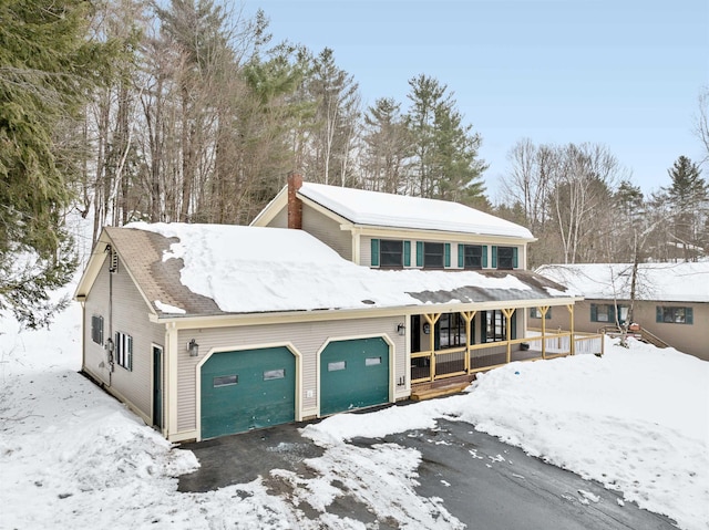 view of front of house featuring covered porch and a chimney