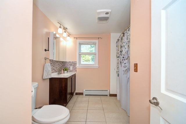 bathroom with toilet, tile patterned floors, baseboard heating, vanity, and backsplash