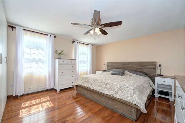 bedroom featuring ceiling fan and wood finished floors