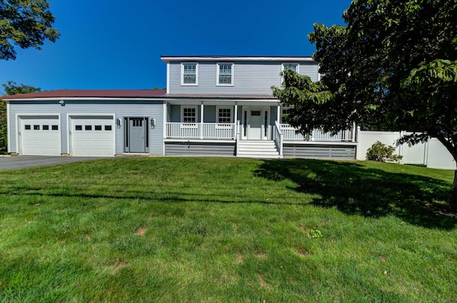 view of front of home with aphalt driveway, a porch, an attached garage, fence, and a front lawn