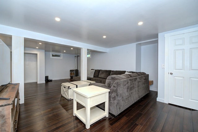 living room with baseboards, dark wood-style flooring, and recessed lighting