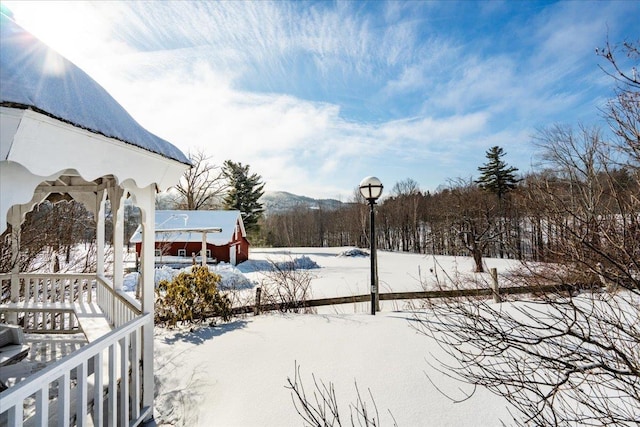 view of yard covered in snow