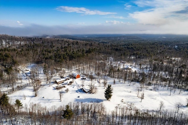 snowy aerial view with a view of trees