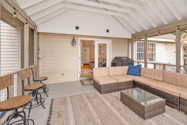 wooden deck with grilling area and an outdoor hangout area