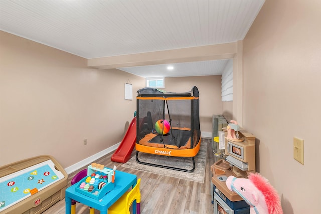 game room with wood finished floors and baseboards