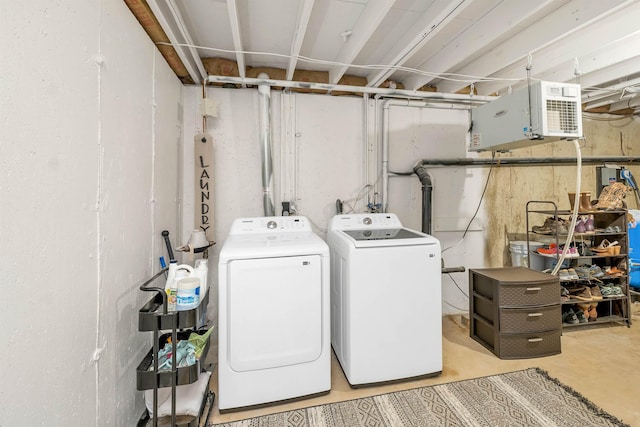 clothes washing area featuring laundry area and washing machine and dryer