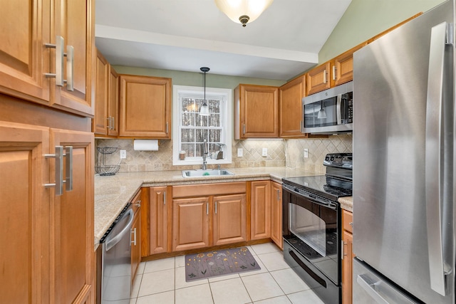 kitchen with backsplash, stainless steel appliances, a sink, and light tile patterned flooring