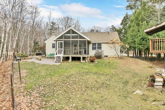 back of house with a yard and a sunroom