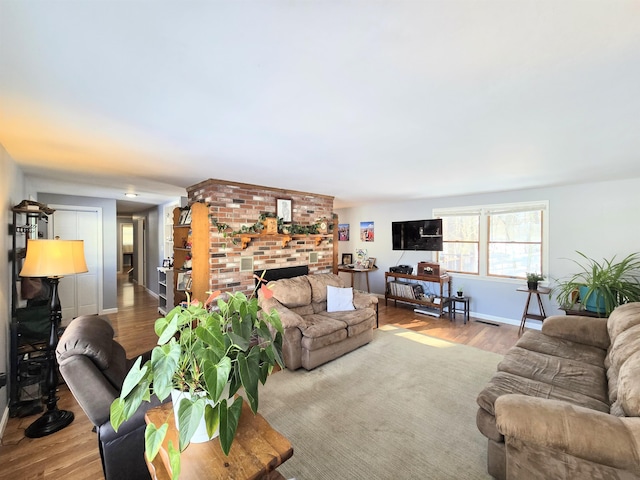 living room featuring baseboards and wood finished floors