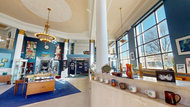 interior space featuring decorative columns and a notable chandelier