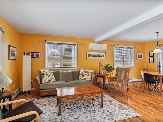 living area with a baseboard radiator, an AC wall unit, beamed ceiling, and wood finished floors