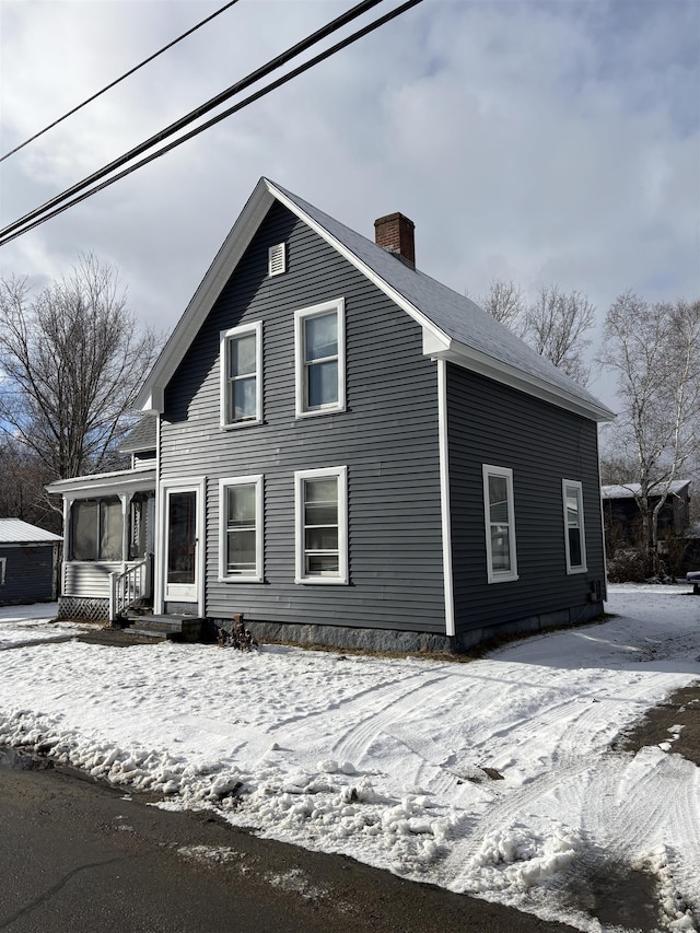 view of front of house with a chimney