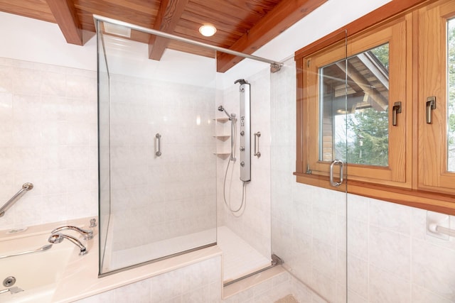 full bathroom with wood ceiling, beam ceiling, and tiled shower