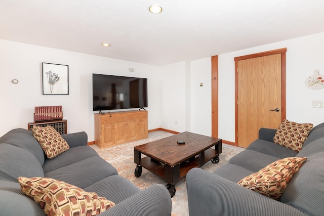 living room with recessed lighting and baseboards