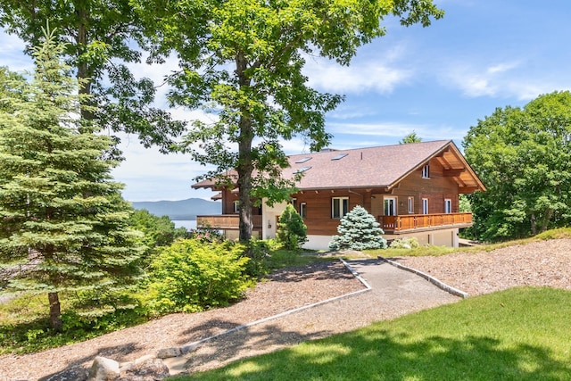 back of property featuring a wooden deck