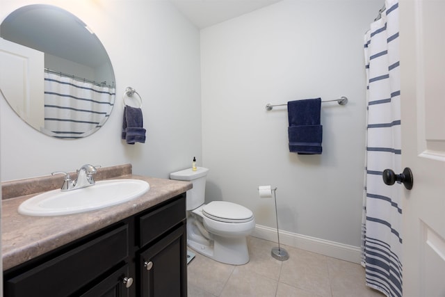 full bathroom with baseboards, vanity, toilet, and tile patterned floors