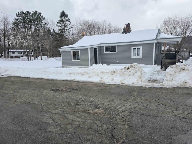 view of front of home with a chimney