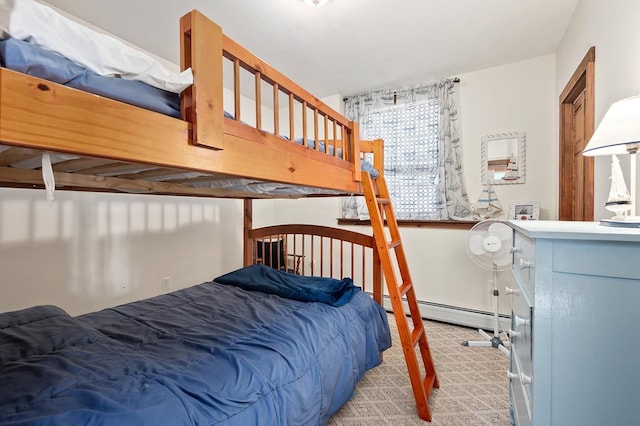 carpeted bedroom with a baseboard radiator