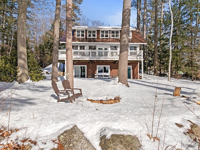 back of property with a wooden deck