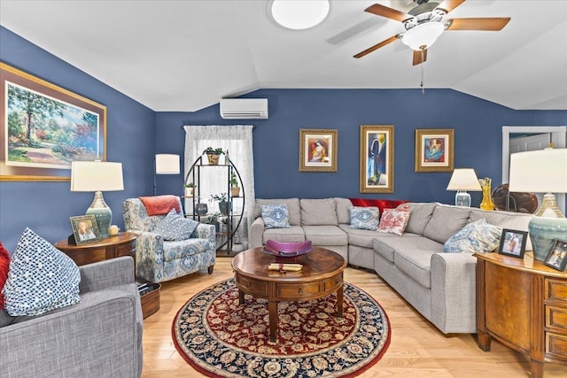 living room with ceiling fan, an AC wall unit, vaulted ceiling, and wood finished floors