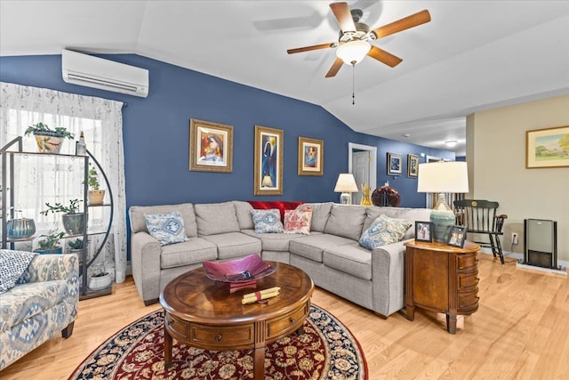 living area featuring light wood-style floors, ceiling fan, vaulted ceiling, and an AC wall unit