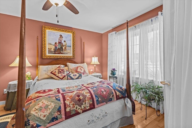 bedroom with ceiling fan and wood finished floors