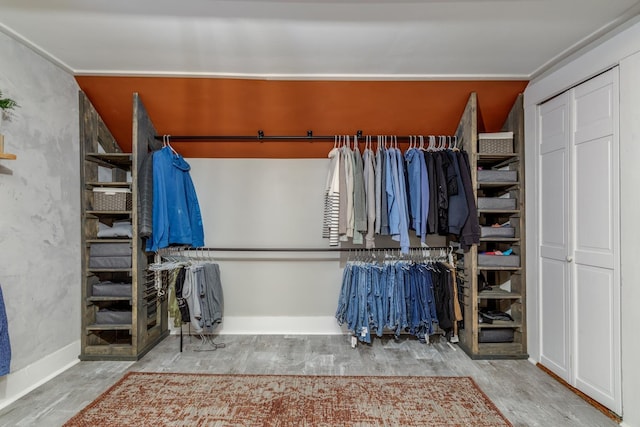 spacious closet featuring wood finished floors