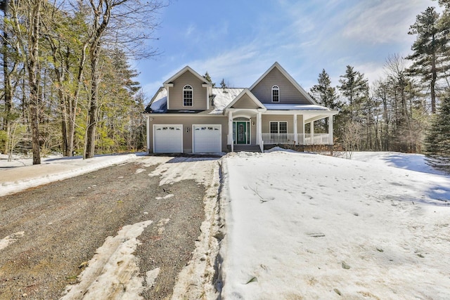 view of front of property with a garage and a porch