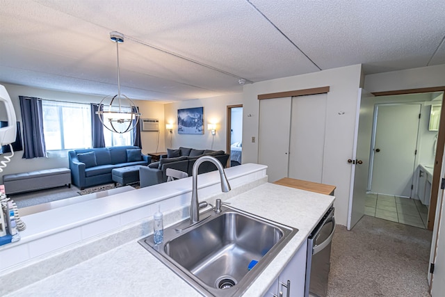 kitchen with carpet floors, a textured ceiling, light countertops, and a sink