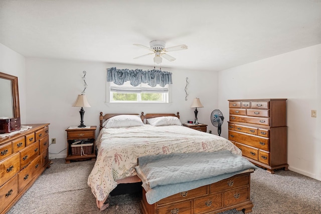 bedroom with a ceiling fan and light carpet