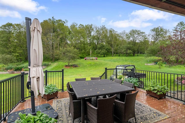 view of patio / terrace with outdoor dining area and a deck