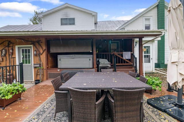 wooden terrace with outdoor dining area