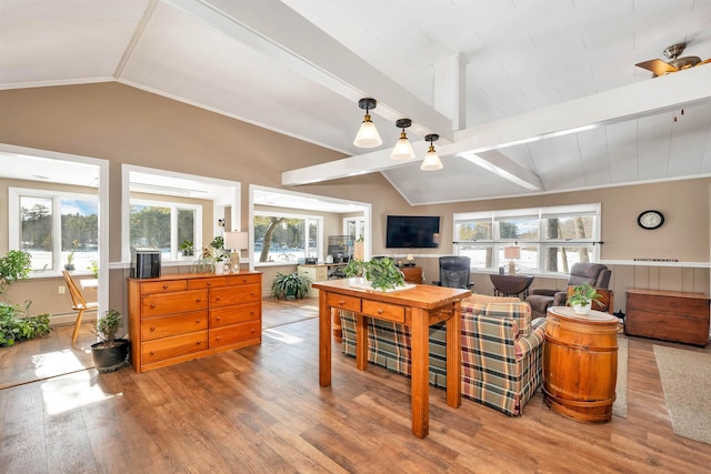 living room featuring vaulted ceiling with beams and wood finished floors