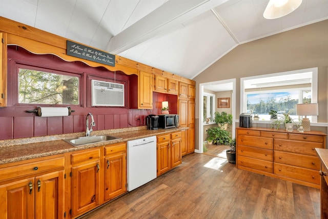 kitchen with dark wood-style flooring, stainless steel microwave, vaulted ceiling, a sink, and dishwasher