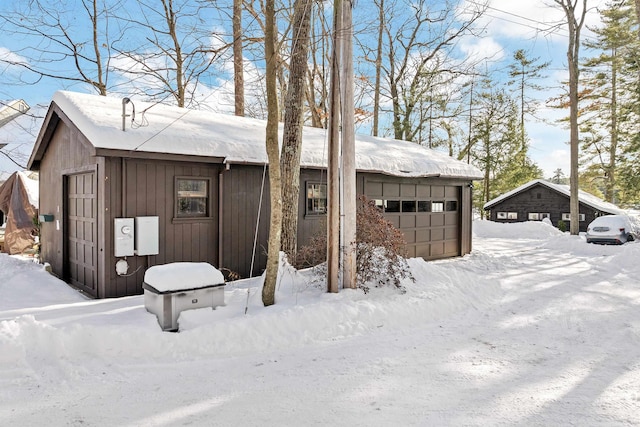 view of snow covered garage