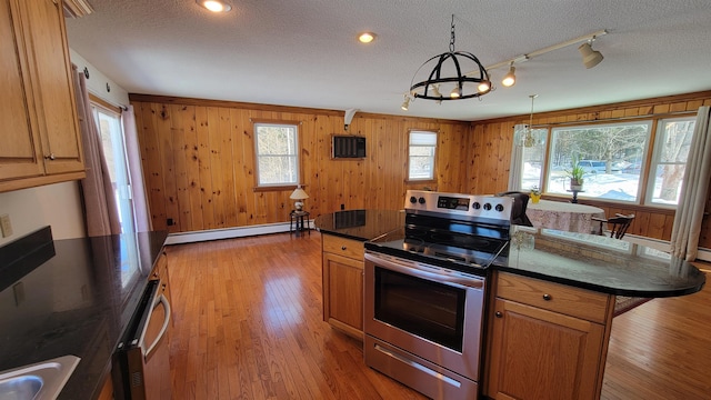 kitchen featuring a textured ceiling, a baseboard heating unit, electric stove, light wood-type flooring, and brown cabinets