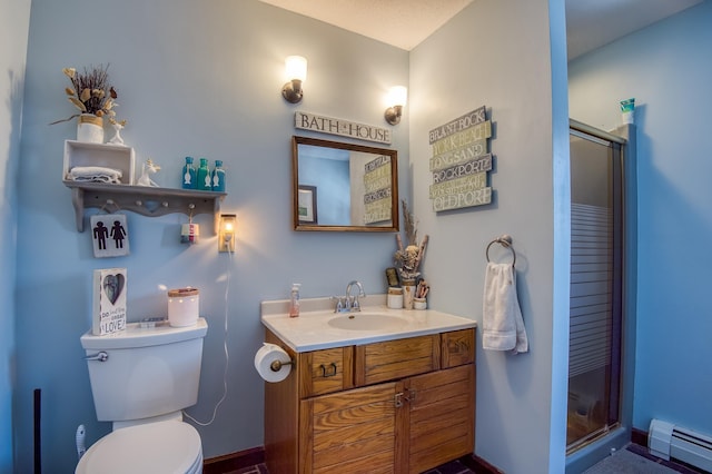 full bathroom featuring toilet, baseboard heating, vanity, and a stall shower