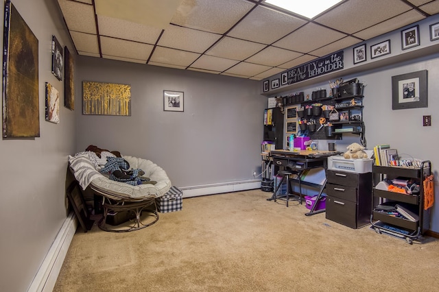 carpeted home office with a paneled ceiling, a baseboard radiator, baseboards, and baseboard heating