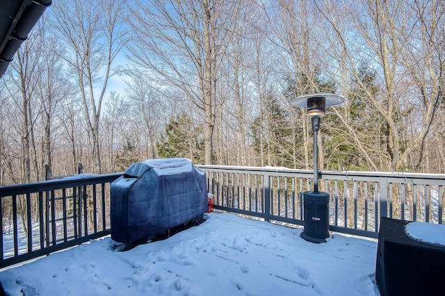 snow covered deck with grilling area