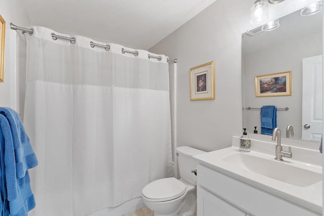 bathroom featuring vanity, toilet, and a shower with curtain