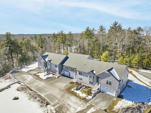 birds eye view of property with a forest view