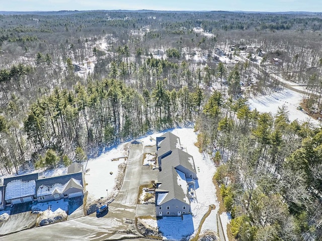 drone / aerial view with a wooded view