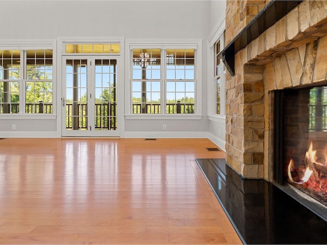 interior space with a healthy amount of sunlight, a fireplace, and visible vents